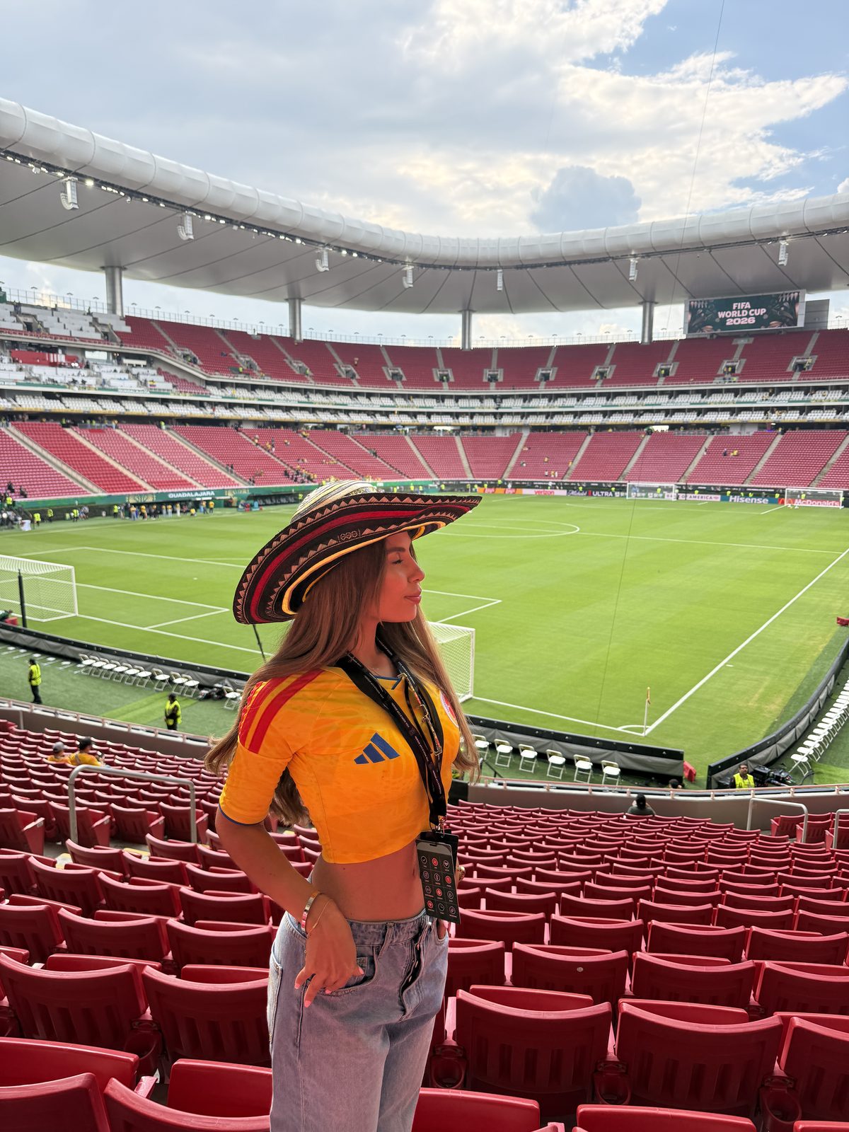 Isabella in a sombrero and Mexico shirt at a stadium